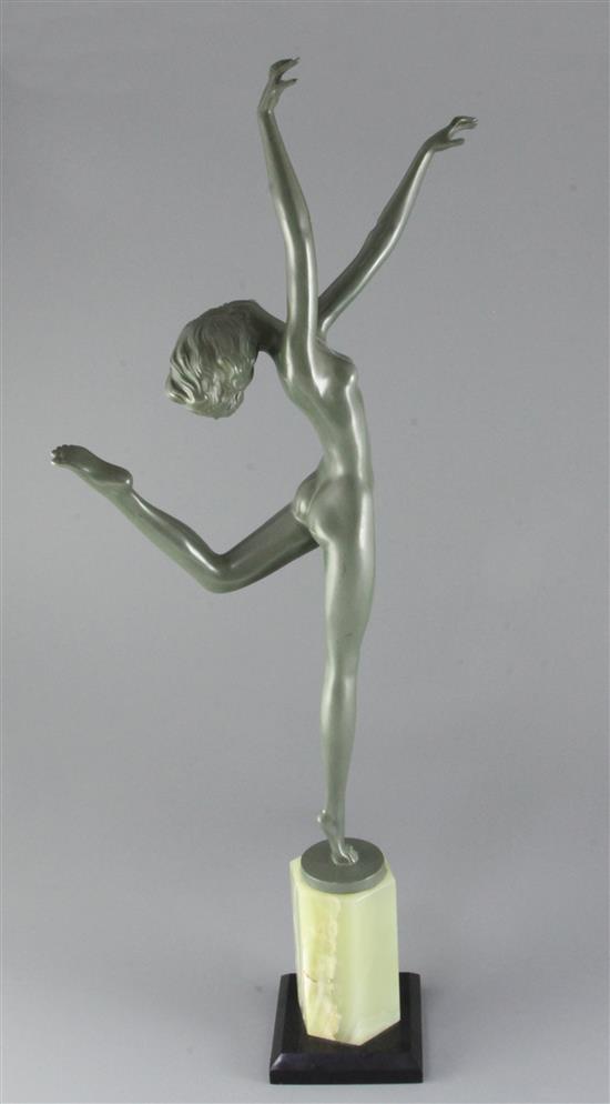 A green patinated bronze figure of a nude dancer in the style of Josef Lorenzl, H. 26in. overall